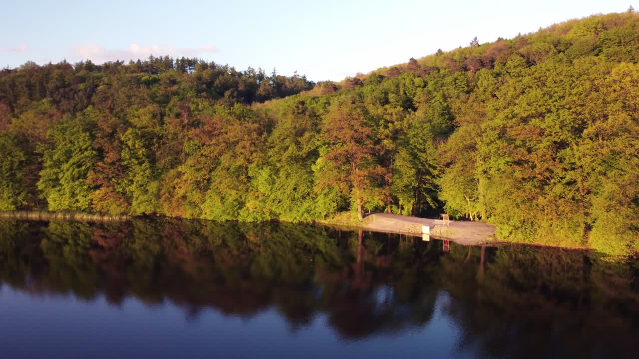 Beautiful Lake Reflection in a Forest at Sunset