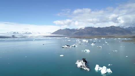 aerial view of icebergs in a glacial lagoon