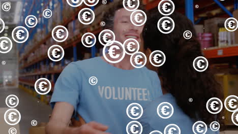 animation of euro symbols flickering over diverse volunteers in warehouse