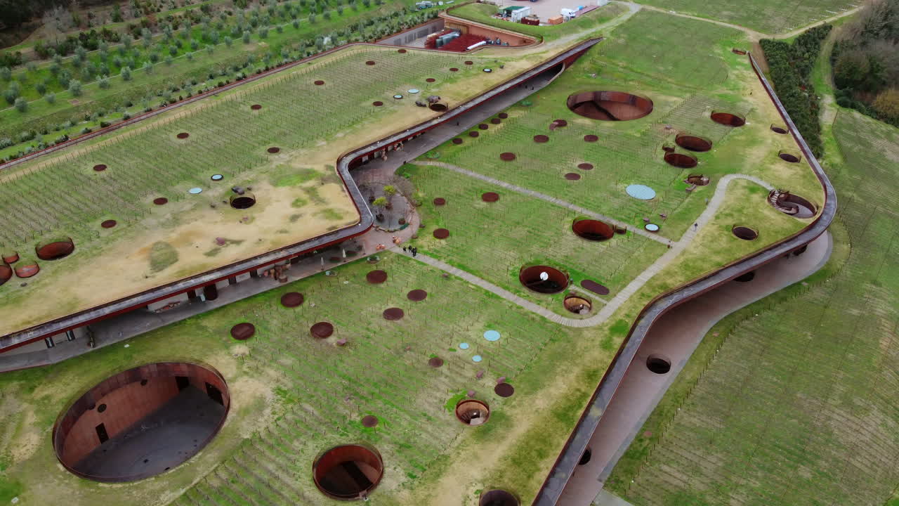 Top shot flying around a Spectacular Winery Integrated into the Tuscany Countryside