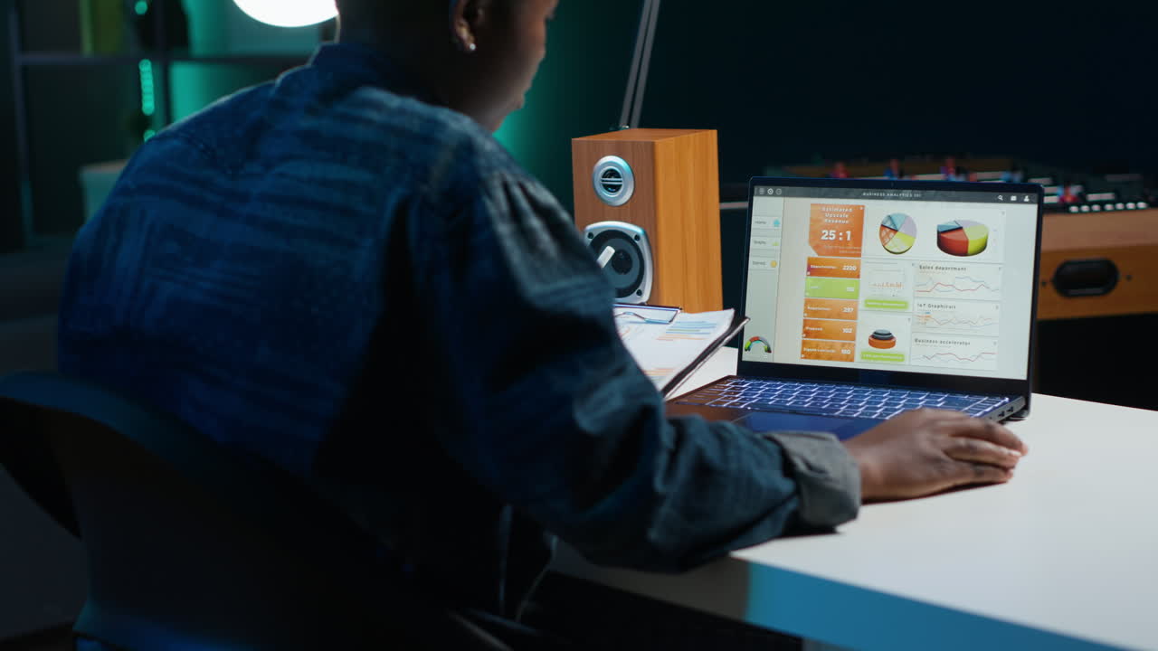 Person working on laptop at night