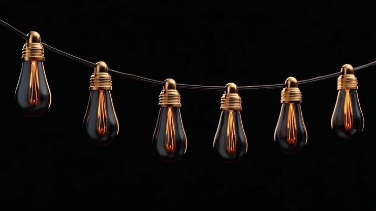 Illuminated Vintage Bulbs on a String: A Warm Glow Against a Dark Background, Capturing the Beauty of Retro Lighting in Both Dim and Bright Forms