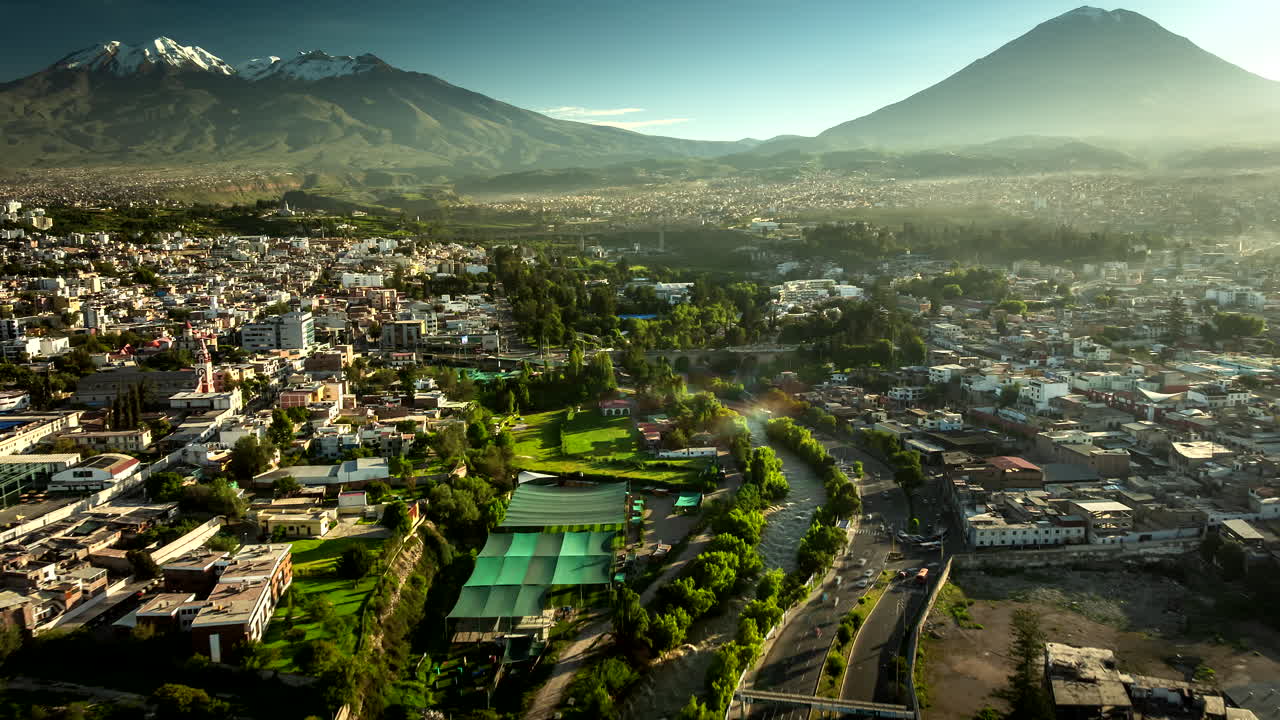 Arequipa UNESCO site historical center with traffic and river. Drone hyperlapse