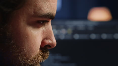developer concentrating hard while doing coding, extreme close up shot