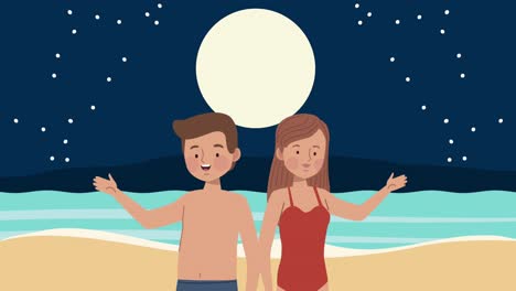 young couple on the beach at night