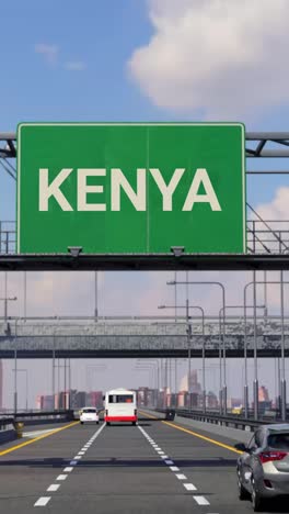 highway sign to kenya with airplane in the sky