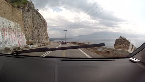 driving on the autobahn in greece between ioannina and patra in a summer day