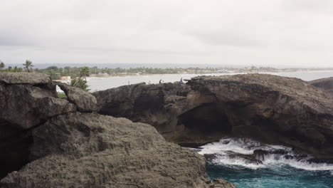 rugged landscape at cueva del indio in las piedras, puerto rico - aerial drone shot