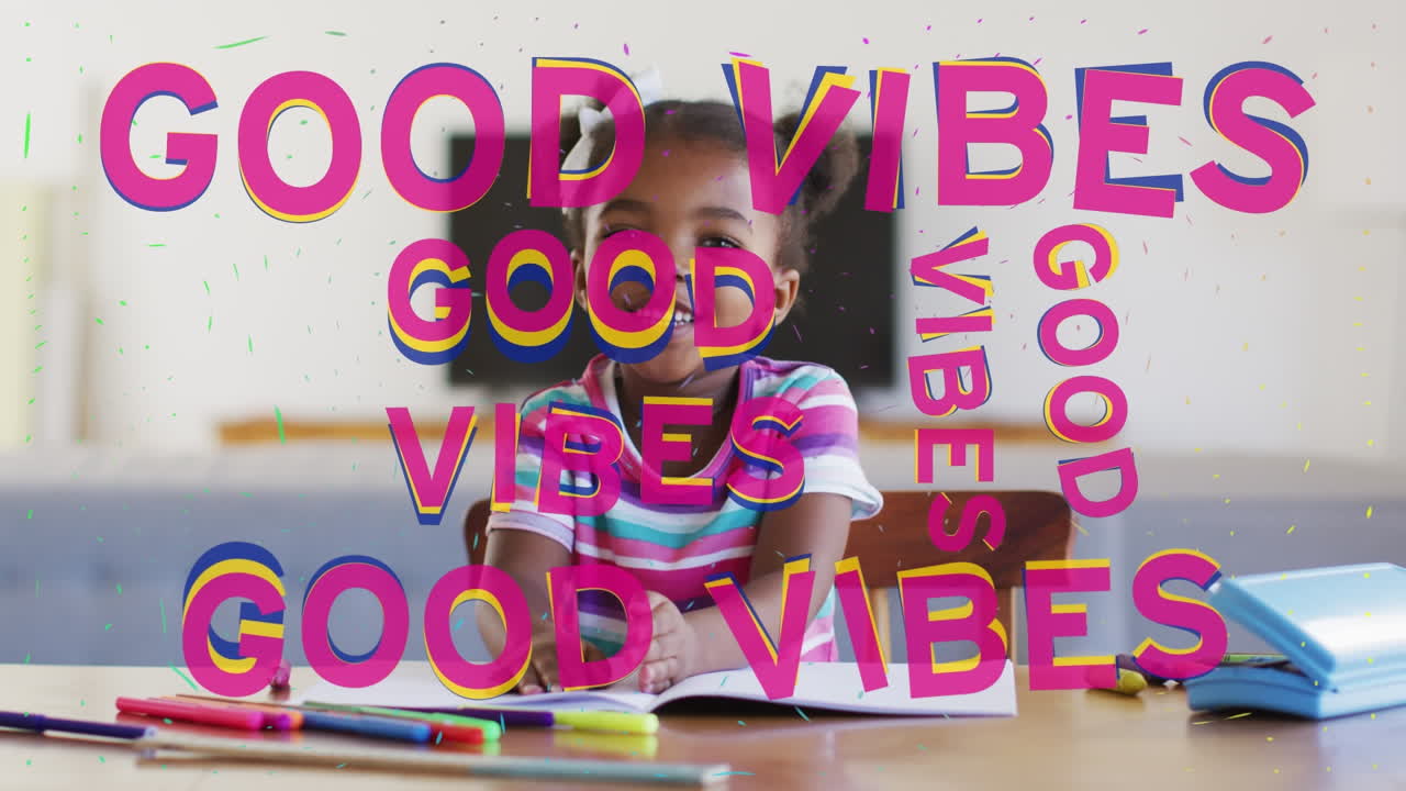 Animation of good vibes text over smiling african american schoolgirl in classroom