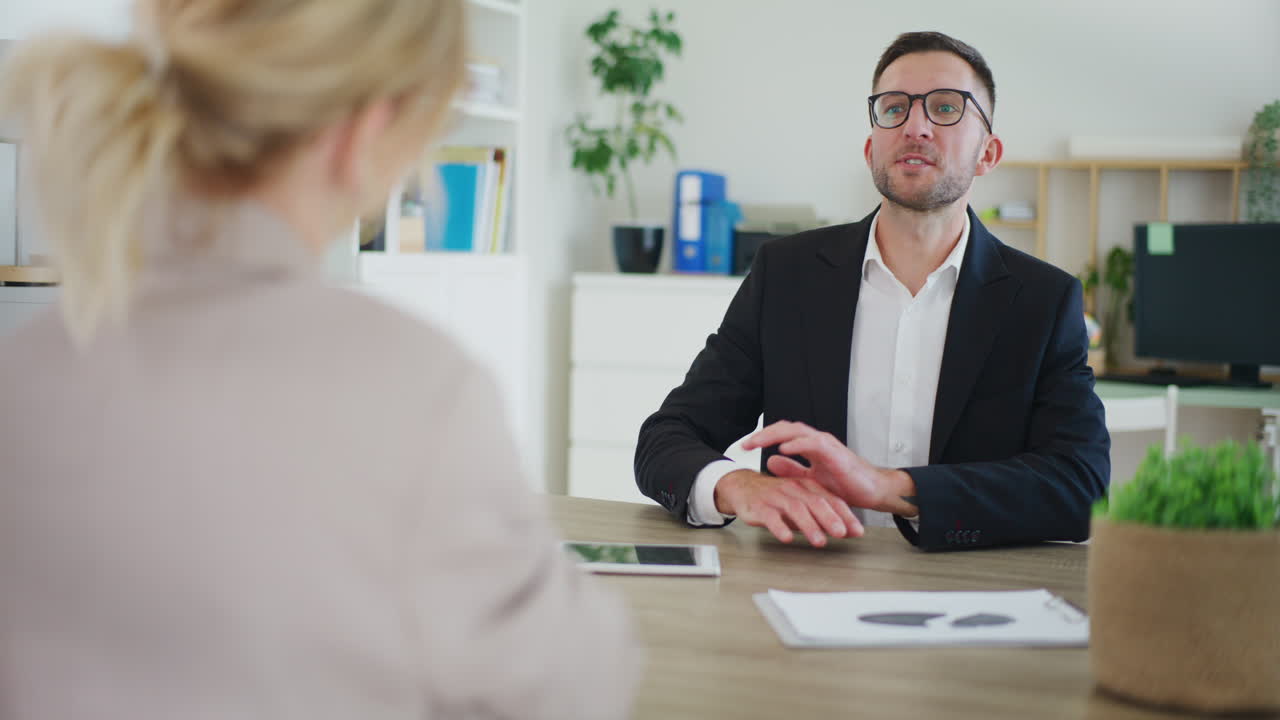 Real Estate Agent Concludes Transaction, Shakes Hands with Client