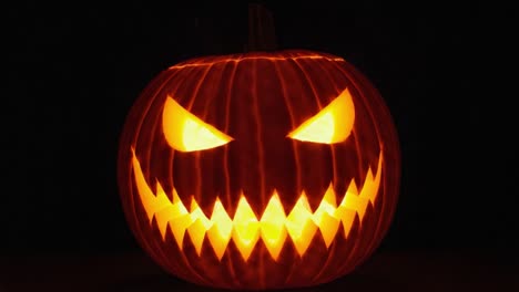 a spooky, glowing jack-o'-lantern with sinister eyes and jagged grin, perfect for setting the halloween mood and creating an eerie atmosphere