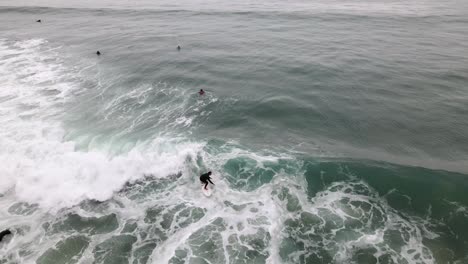 excellent aerial view of surfers on the waves