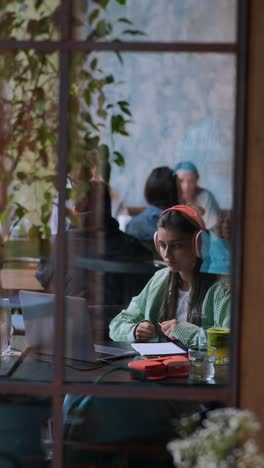 woman studying in a cafe