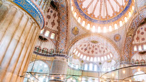 zoom out timelapse of the blue mosque interior or sultanahmet indoors in istanbul city in turkey