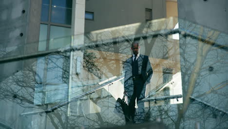 businessman walking upstairs in a modern building