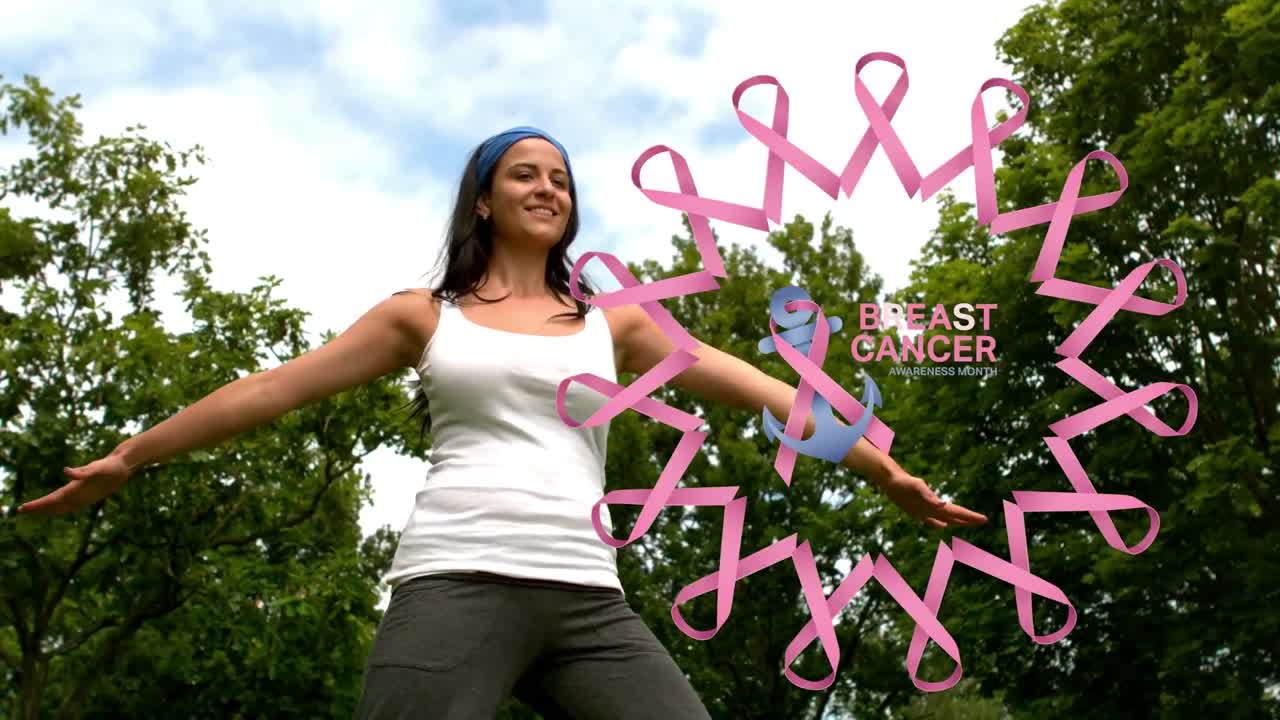 Animación de texto del mes de concienciación sobre el cáncer sobre mujer birracial practicando yoga