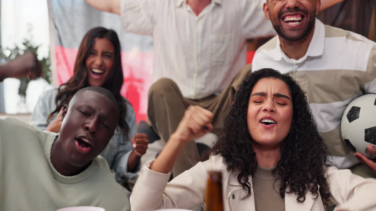 Excited soccer fans celebrating a win at home
