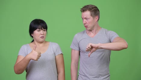 young multi-ethnic couple having different decisions together