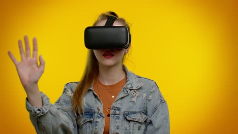 Girl-using-virtual-reality-futuristic-technology-VR-headset-helmet-to-play-simulation-3D-video-game