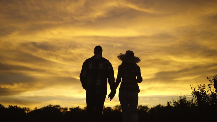 Romantic Couple Walking into Sunset