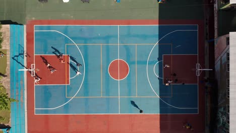 men training basketball on outdoor sports ground