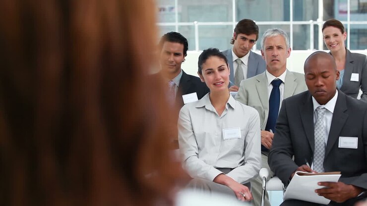 Woman making a speech in front of an audience