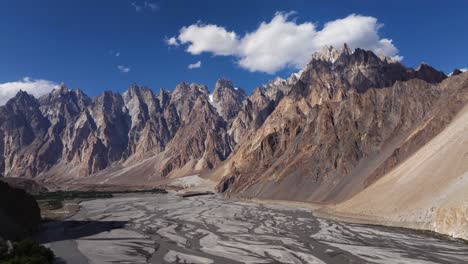 backward drone shot - passu cones mountains. hunza river, pakistan