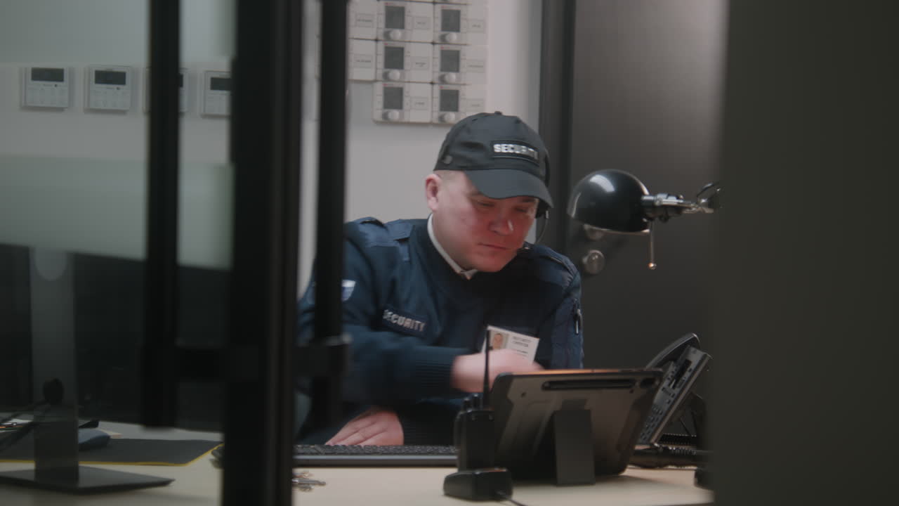 Security Guard Monitoring Control Room