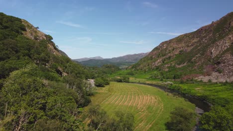 valley on bright sunny day drone shot in wales, united kingdom