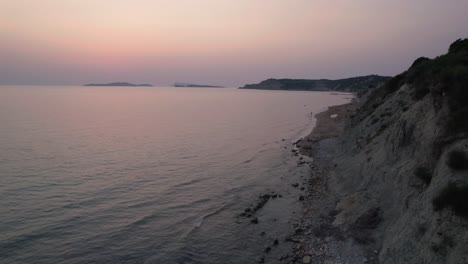 establishing aerial drone shotof people enjoying the beach at arillas, corfu, greece