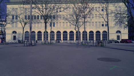 facade of swiss national bank snb branch zürich on a sunny spring day with bürkli square in the foreground.