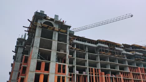construction of high-rise building. front view of huge building in the process of construction. new construction site in the city.