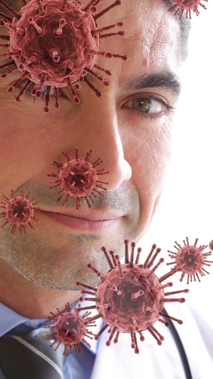 Animazione di cellule virali su un medico sorridente