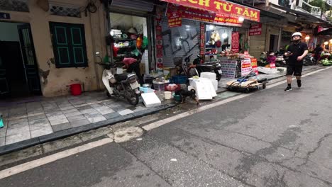 street vendors and pedestrians in hanoi market