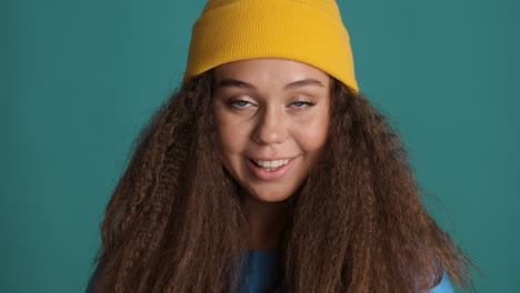 caucasian curly haired woman wearing winter clothes.