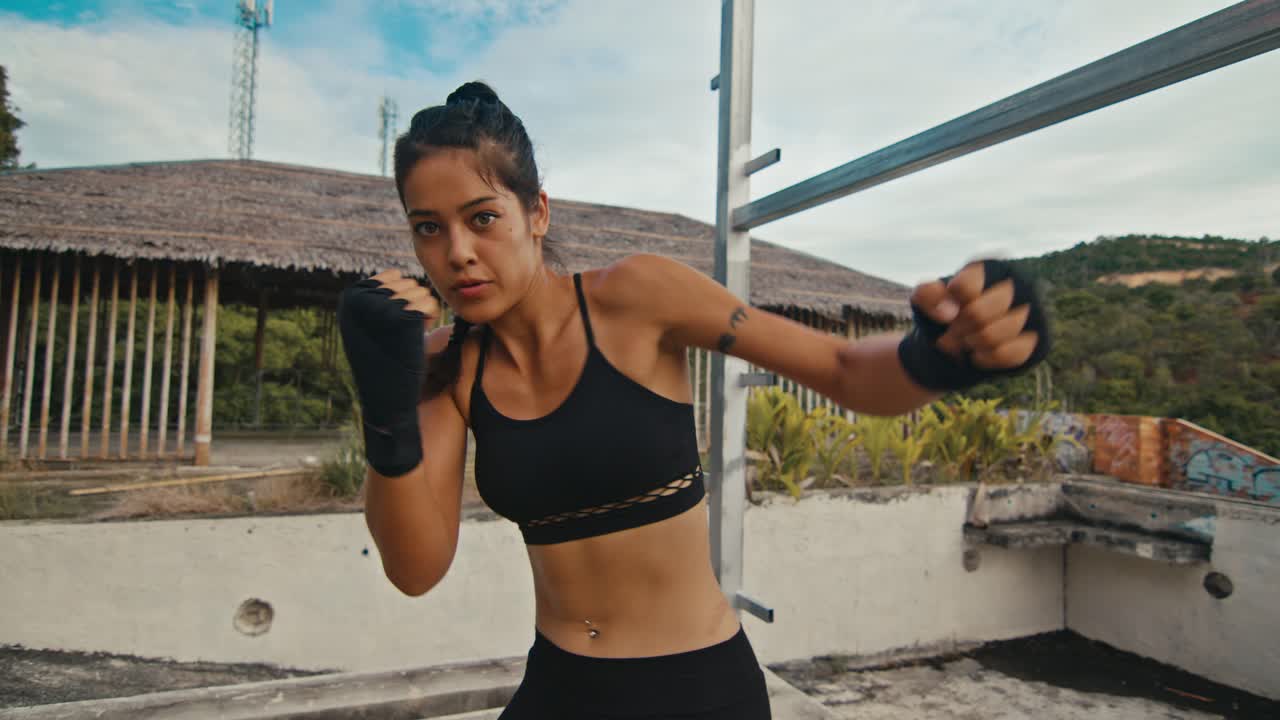 Woman Boxing on Rooftop