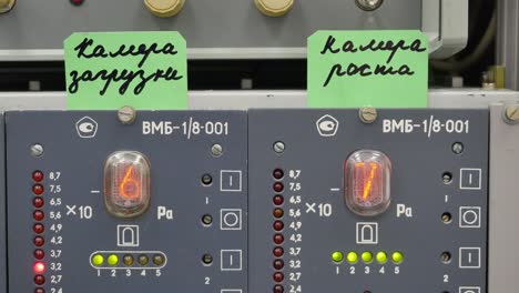 industrial control panel with pressure gauges and displays