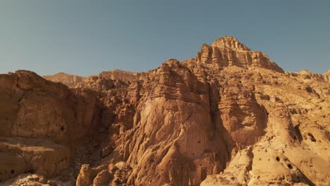 a side to side drone shot of a generic big desert mountain, great as a transition for a travel vlog