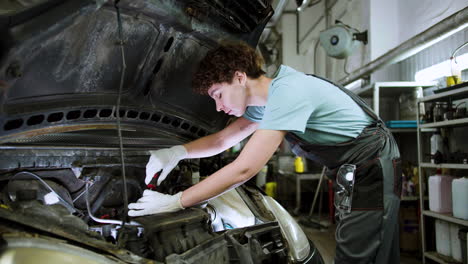 woman repairing car