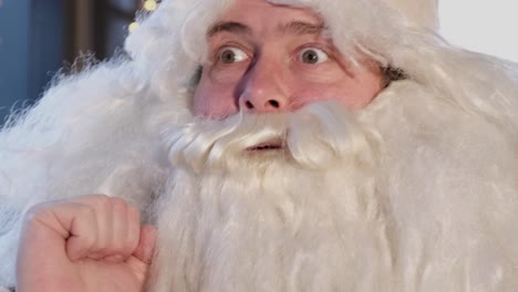 claus napping with a supported hand happy new year 2023 and merry christmas santa claus napping with a supported hand funny man in costume of santa claus face close up