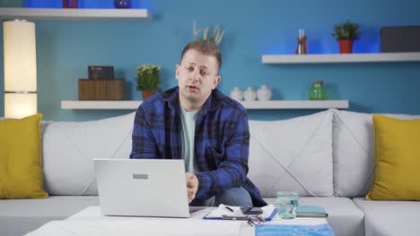 home office worker man looking emotional at camera.