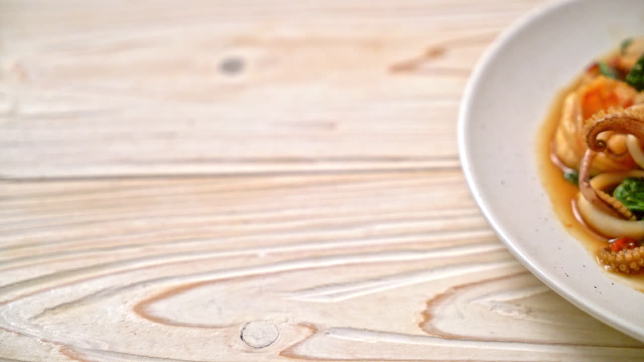 stir-fried seafood (shrimps and squid) with Thai basil - Asian food style