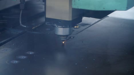 Laser-cutting-of-metal-sheet-close-up.-Modern-industrial-technologies