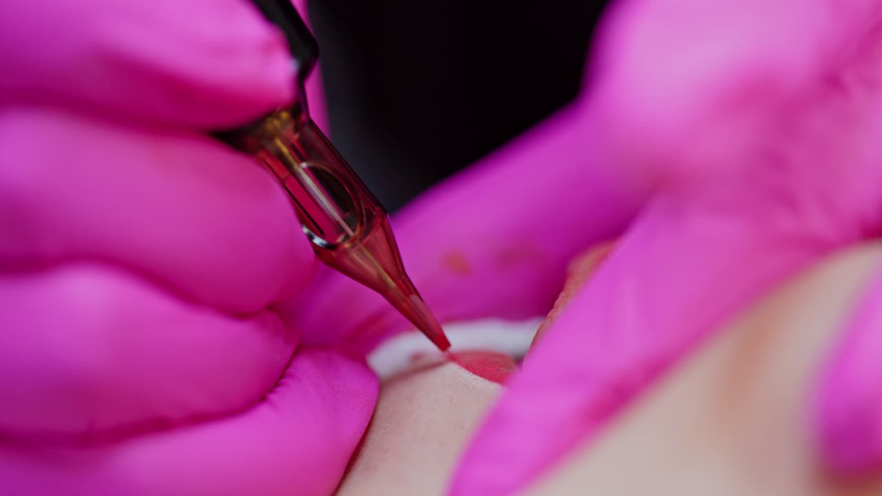 Cosmetologist applying permanent make up. Woman having permanent makeup on lips