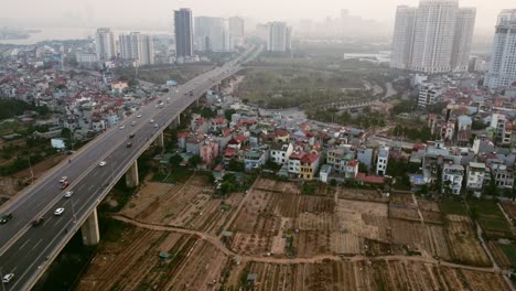 aerial drone view of a busy bridge road into the city in hanoi in vietnam