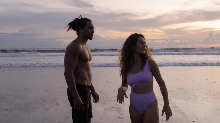Young couple in swimwear in the beach
