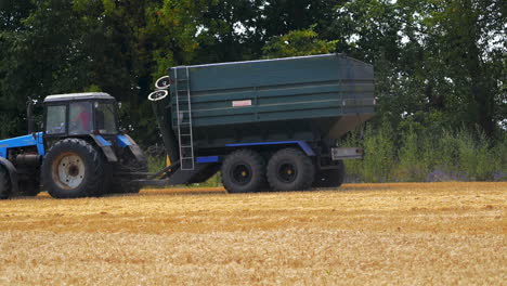 harvester moves in wheat field. agricultural machinery working in the wheat field