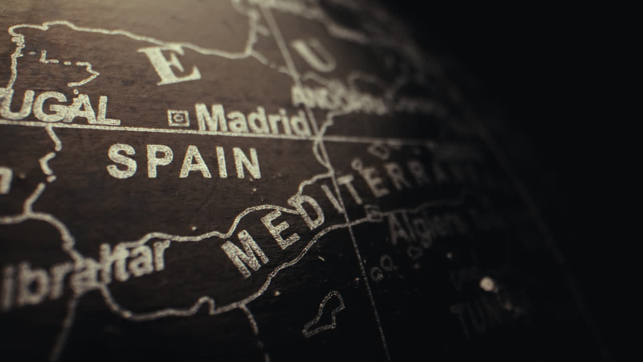 Close-up of a vintage world globe highlighting Spain and the Mediterranean region