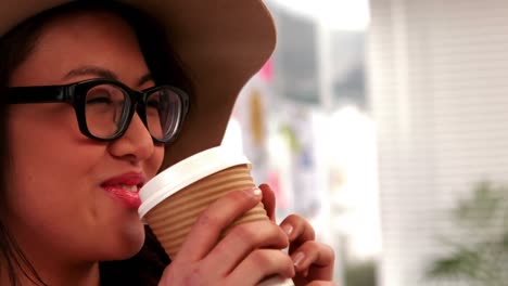 gorgeous hipster drinking out of take-away cup