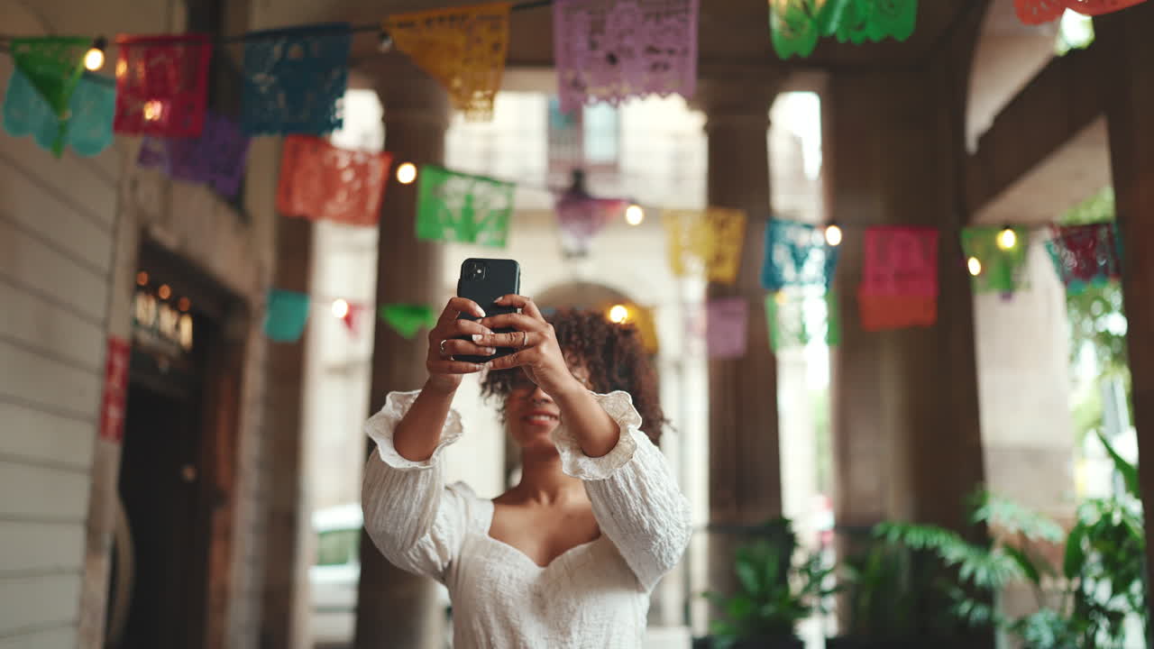 Woman taking a photo with a phone